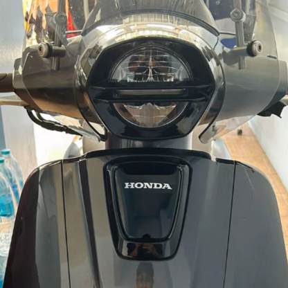 FRONT LIGHT LOGO FRAME HONDA GIORNO+ 125